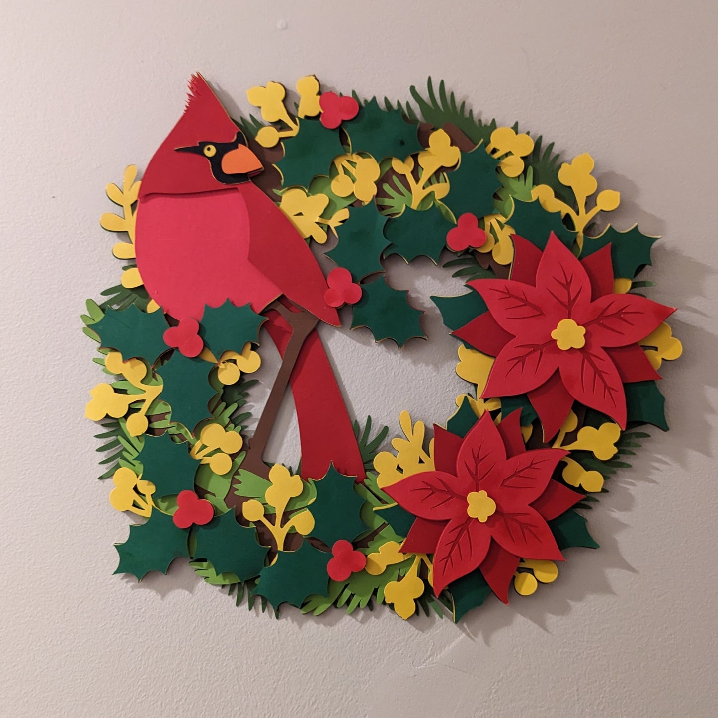 Holiday Elegance: 15-Inch Layered Cardstock Poinsettia Wreath with Festive Avian Accent